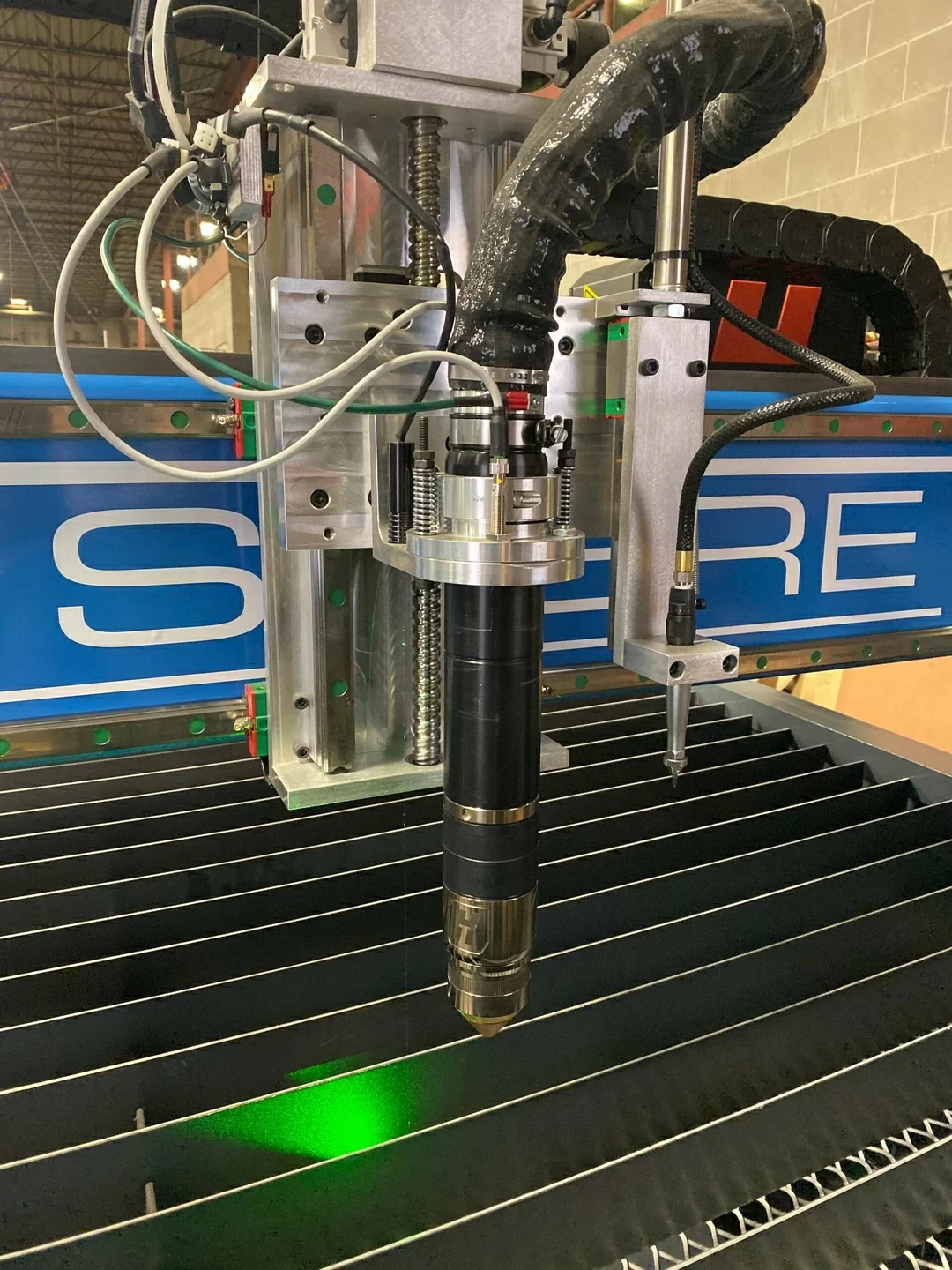 a tall shot of a laser on a cnc plasma machine